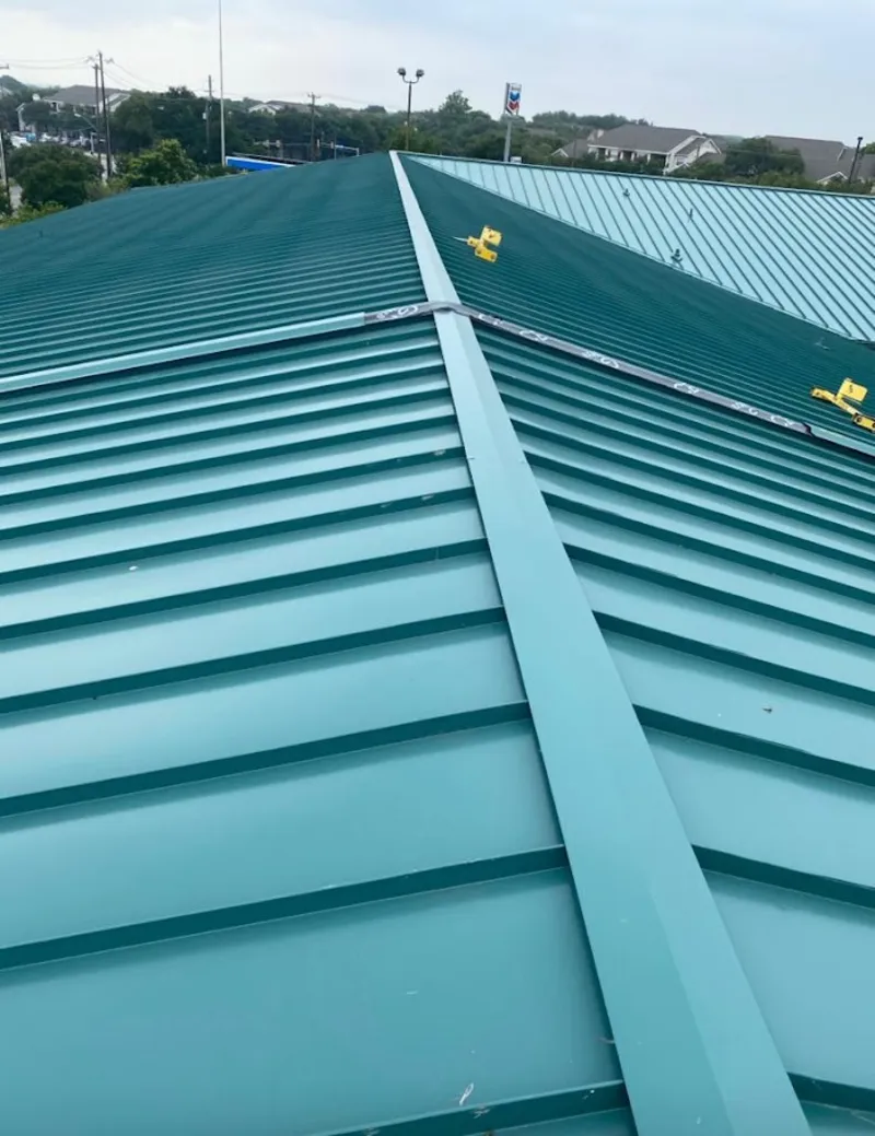 Green commercial metal roof ridge and valley for Metal Roof Repair in El Dorado